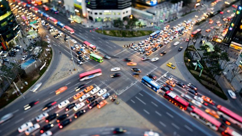 The photo shows a busy traffic intersection in a city.