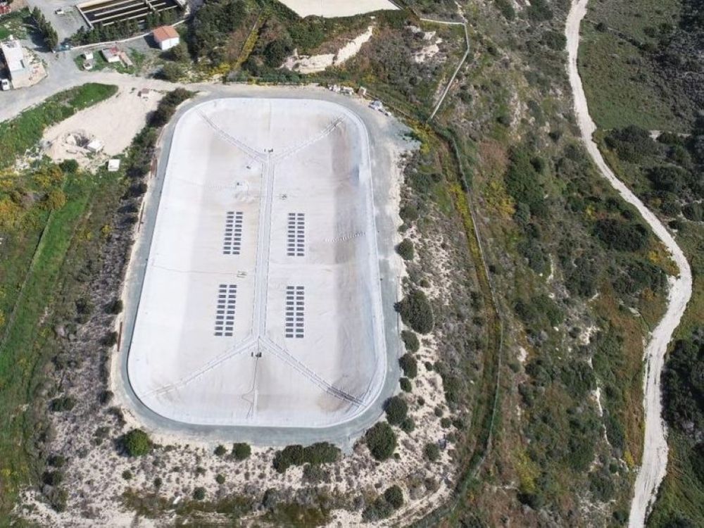 The photo shows a cover foil for a water reservoir with crystalline photovoltaic modules in Cyprus.