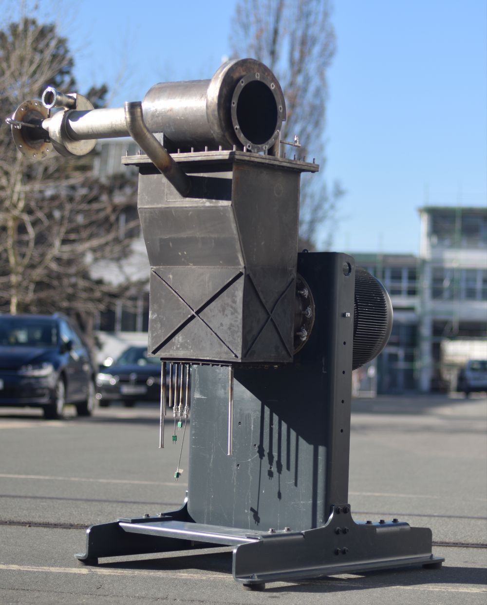 The photo shows the developed MINI CHP system with Stirling engine in a steel shell.