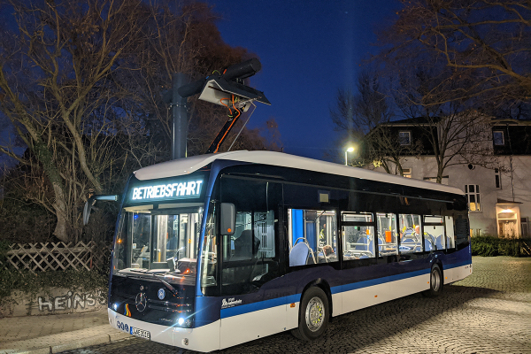 Electric bus at night.
